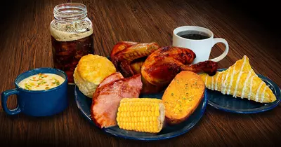 corn ham chicken biscuit turnover soup coffee tea on a table