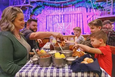 family enjoying the feast at Hatfield & McCoy