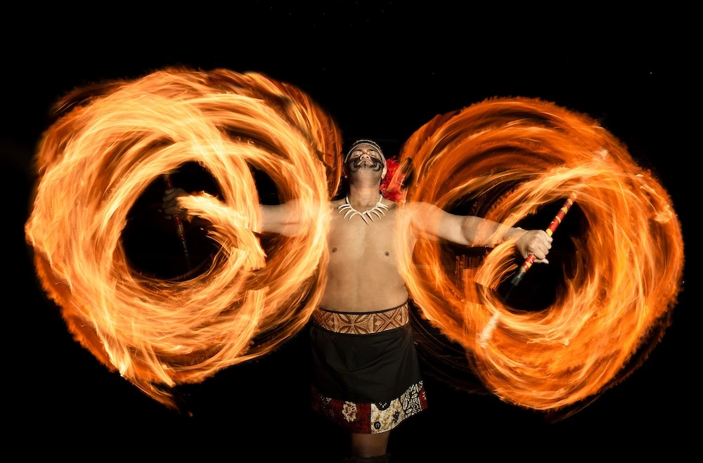 performer twirling fire