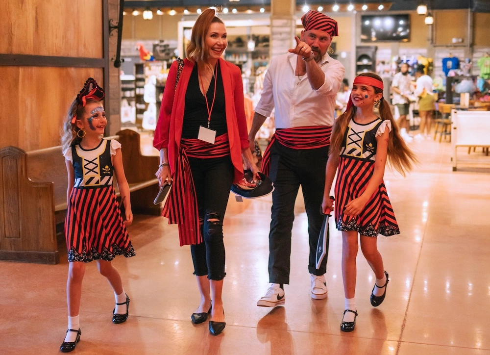 family after pirate and mermaid makeovers at Pirates Voyage