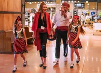 family after pirate and mermaid makeovers at Pirates Voyage